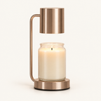 Calla candle warmer lamp in rose gold with cylinder shade warming a jar candle