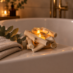 Driftwood tealight holder on a bathtub ledge in a calm bathroom