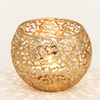 Glow Sphere tealight holder in Gold, pierced metal globe with a lit tealight