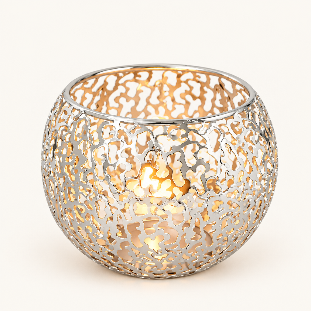 Glow Sphere tealight holder in Silver, pierced metal globe with a lit tealight