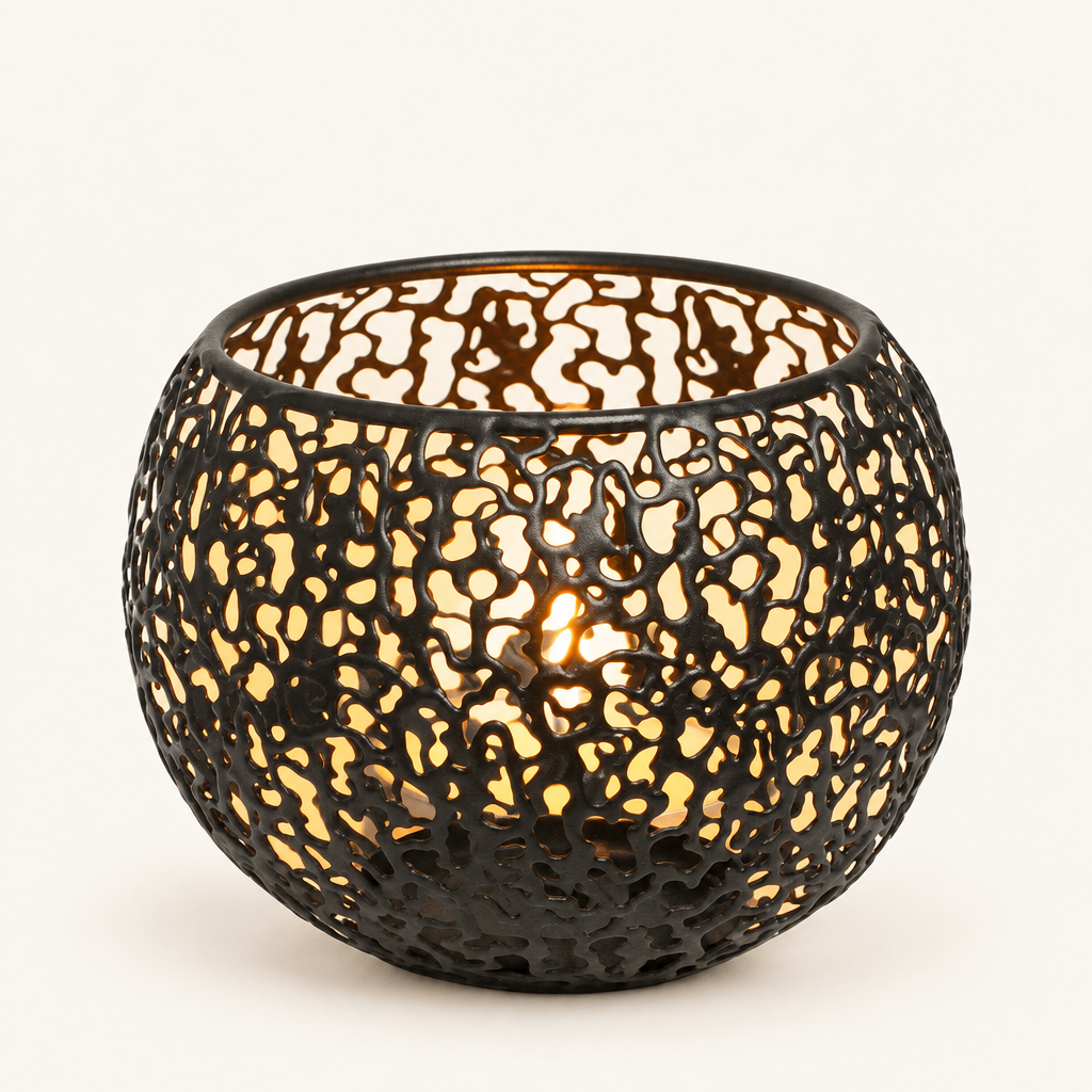 Glow Sphere tealight holder in Black, pierced metal globe with a lit tealight