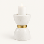 Large Colette marble hourglass candle holder with a lit white pillar candle