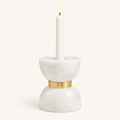 Small Colette marble hourglass candle holder with a lit white taper candle