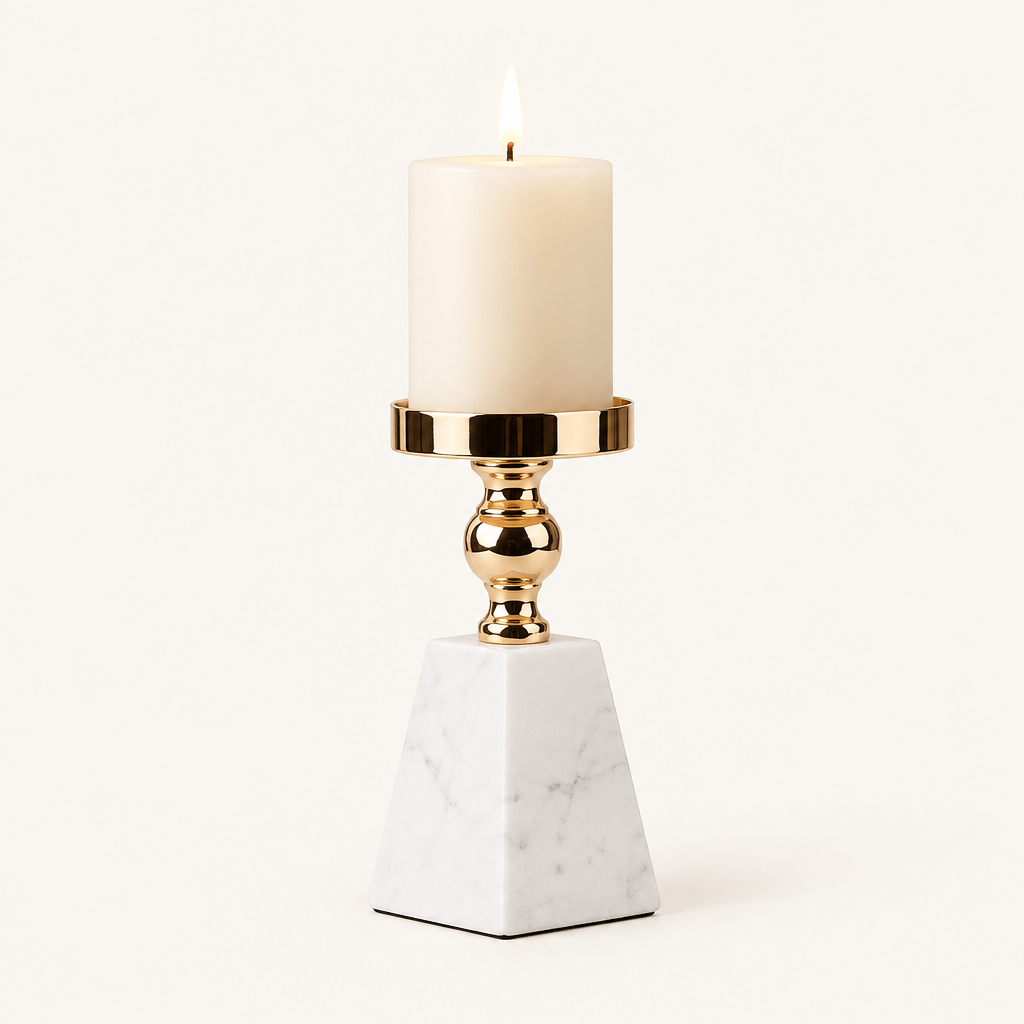 Pyramid marble and gold pillar candle holder, size M, with a lit ivory candle on a warm off-white background