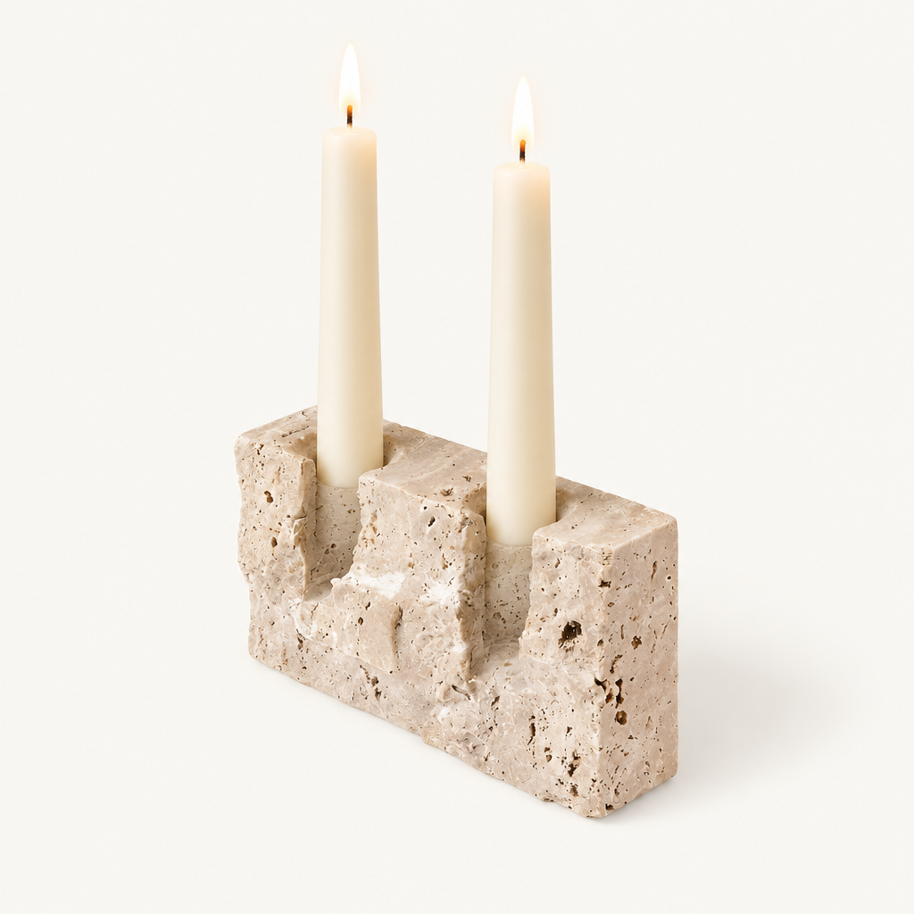 Timeless Glow travertine candle stand, Raw finish, with two lit ivory taper candles