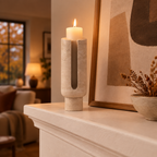 Travertine Eclipse candle holder on a fireplace mantel on an autumn evening