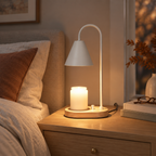 White Cone candle warmer lamp on a bedside nightstand in autumn