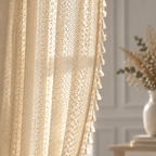 Chic Bohemian Crochet Curtain — backlit close-up of geometric crochet lace and cream tassels